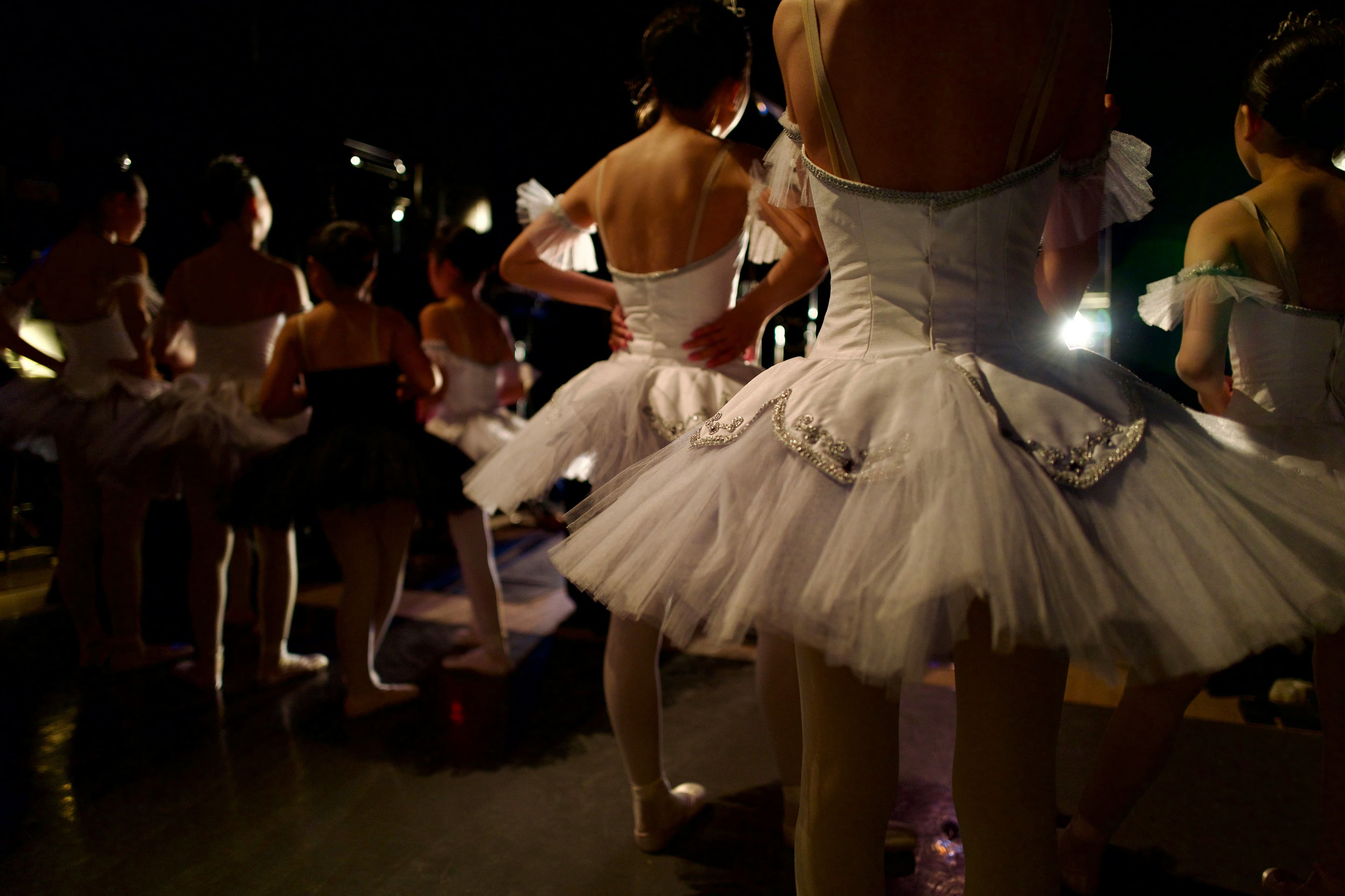 Ballerinas in white tutu's waiting to go on stage